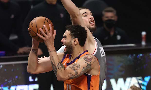 JUNE 26: Abdel Nader #11 of the Phoenix Suns goes up for a shot against Ivica Zubac #40 of the LA C...