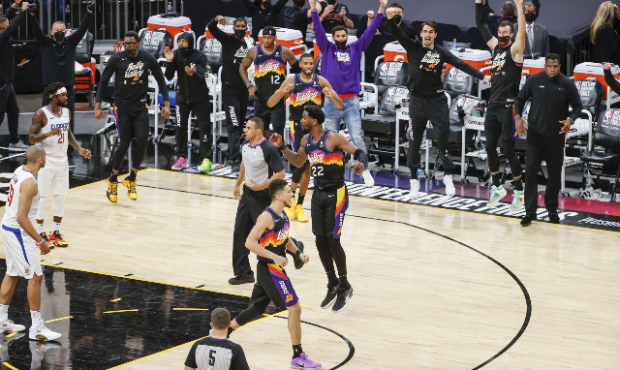 Deandre Ayton #22 of the Phoenix Suns celebrates in the final minutes against the LA Clippers in ga...