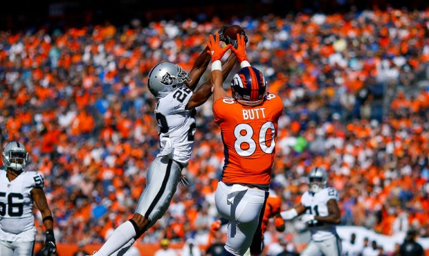 Defensive back Rashaan Melvin #22 of the Oakland Raiders intercepts a pass intended for tight end J...