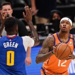 DENVER, CO - JUNE 11:  Torrey Craig #12 of the Phoenix Suns shoots as he is defended by JaMychal Green #0 of the Denver Nuggets in Game Three of the Western Conference second-round playoff series at Ball Arena on June 11, 2021 in Denver, Colorado. (Photo by Dustin Bradford/Getty Images)
