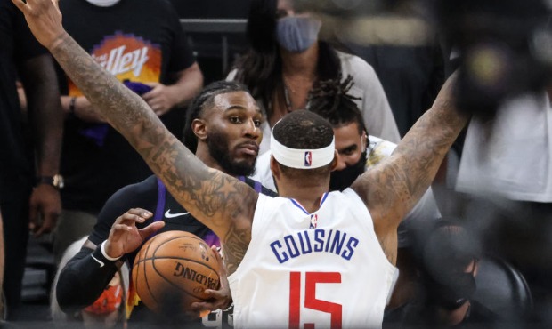 Phoenix Suns forward Jae Crowder (99) surveys the court as LA Clippers center DeMarcus Cousins (15)...