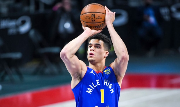 Michael Porter Jr. #1 of the Denver Nuggets shoots a free throw against the Detroit Pistons during ...