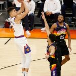 PHOENIX, ARIZONA - JUNE 09:  Michael Porter Jr. #1 of the Denver Nuggets attempts a shot over Devin Booker #1 of the Phoenix Suns during the first half in Game Two of the Western Conference second-round playoff series at Phoenix Suns Arena on June 09, 2021 in Phoenix, Arizona. (Photo by Christian Petersen/Getty Images)