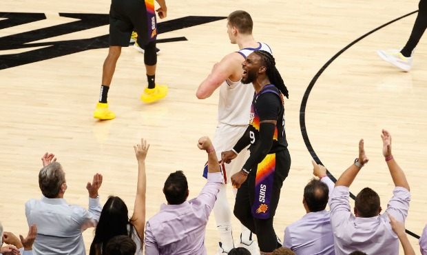 Jae Crowder #99 of the Phoenix Suns reacts after scoring against the Denver Nuggets during the seco...