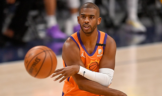 Chris Paul #3 of the Phoenix Suns passes the ball against the Denver Nuggets in Game Three of the W...