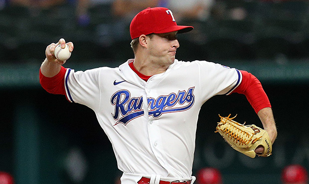 Brett de Geus #56 of the Texas Rangers pitches in the second inning against the Oakland Athletics a...
