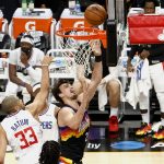 PHOENIX, ARIZONA - JUNE 22: Dario Saric #20 of the Phoenix Suns drives to the basket ahead of defender Nicolas Batum #33 of the LA Clippers during the second quarter in game two of the NBA Western Conference finals at Phoenix Suns Arena on June 22, 2021 in Phoenix, Arizona. NOTE TO USER: User expressly acknowledges and agrees that, by downloading and or using this photograph, User is consenting to the terms and conditions of the Getty Images License Agreement.  (Photo by Christian Petersen/Getty Images)
