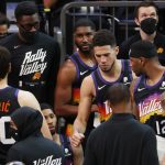 PHOENIX, ARIZONA - JUNE 22: Devin Booker #1 of the Phoenix Suns returns to the game after receiving stitches to a cut on his nose during the fourth quarter in game two of the NBA Western Conference finals at Phoenix Suns Arena on June 22, 2021 in Phoenix, Arizona. NOTE TO USER: User expressly acknowledges and agrees that, by downloading and or using this photograph, User is consenting to the terms and conditions of the Getty Images License Agreement.  (Photo by Christian Petersen/Getty Images)