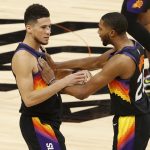 PHOENIX, ARIZONA - JUNE 22: Devin Booker #1 and Mikal Bridges #25 of the Phoenix Suns react during the fourth quarter in game two of the NBA Western Conference finals against the LA Clippers at Phoenix Suns Arena on June 22, 2021 in Phoenix, Arizona. NOTE TO USER: User expressly acknowledges and agrees that, by downloading and or using this photograph, User is consenting to the terms and conditions of the Getty Images License Agreement.  (Photo by Christian Petersen/Getty Images)