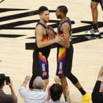 PHOENIX, ARIZONA - JUNE 22: Devin Booker #1 and Mikal Bridges #25 of the Phoenix Suns react during the fourth quarter in game two of the NBA Western Conference finals against the LA Clippers at Phoenix Suns Arena on June 22, 2021 in Phoenix, Arizona. NOTE TO USER: User expressly acknowledges and agrees that, by downloading and or using this photograph, User is consenting to the terms and conditions of the Getty Images License Agreement.  (Photo by Christian Petersen/Getty Images)