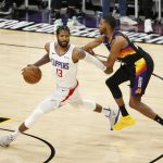 PHOENIX, ARIZONA - JUNE 22: Paul George #13 of the LA Clippers controls the ball ahead of Mikal Bridges #25 of the Phoenix Suns during the fourth quarter in game two of the NBA Western Conference finals at Phoenix Suns Arena on June 22, 2021 in Phoenix, Arizona. NOTE TO USER: User expressly acknowledges and agrees that, by downloading and or using this photograph, User is consenting to the terms and conditions of the Getty Images License Agreement.  (Photo by Christian Petersen/Getty Images)