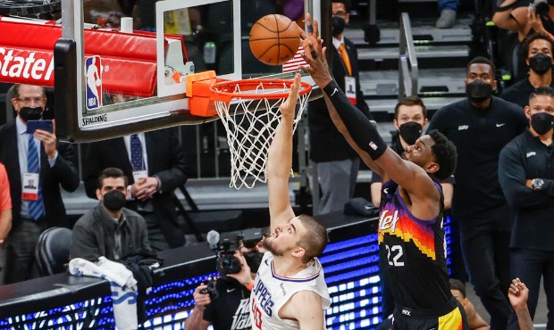 Deandre Ayton #22 of the Phoenix Suns dunks the ball over Ivica Zubac #40 of the LA Clippers during...