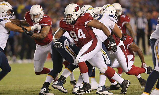 Defensive lineman Xavier Williams #94 of the Arizona Cardinals rushes against the San Diego Charger...