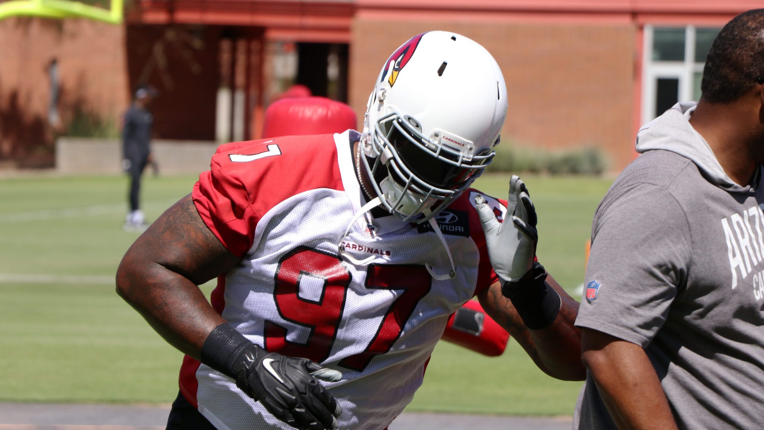 Defensive lineman Jordan Phillips goes through drills during the Cardinals' first day of mandatory ...