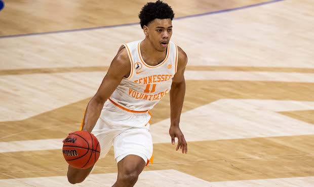 MARCH 12: Jaden Springer #11 of the Tennessee Volunteers dribbles up court against the Florida Gato...