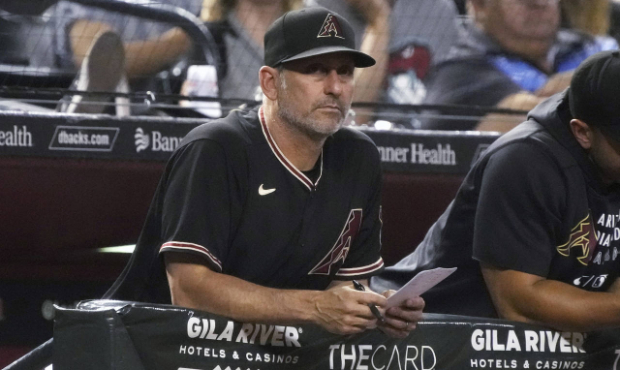 Arizona Diamondbacks manager Torey Lovullo watches from the dugout during the sixth inning of the t...