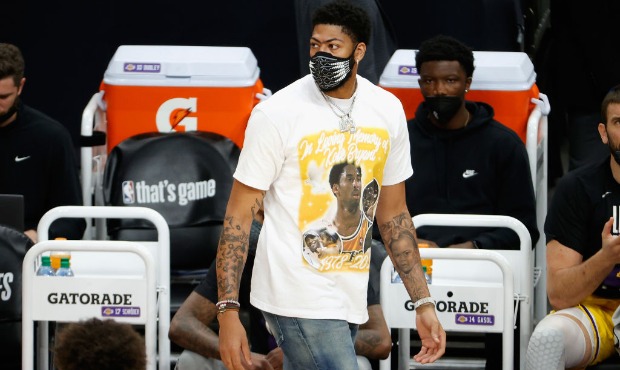 Anthony Davis #3 of the Los Angeles Lakers watches from the bench during the first half in Game Fiv...
