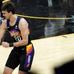 Phoenix Suns forward Dario Saric (20) celebrates a three pointer against the Denver Nuggets during the first half of Game 2 of an NBA basketball second-round playoff series, Wednesday, June 9, 2021, in Phoenix. (AP Photo/Matt York)