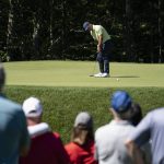 Paul Casey putts on the 11th green as spectators watch during the first round of the Travelers Championship golf tournament at TPC River Highlands, Thursday, June 24, 2021, in Cromwell, Conn. (AP Photo/John Minchillo)