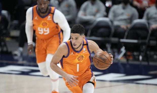 Phoenix Suns guard Devin Booker picks up the ball in the first half of Game 3 of an NBA second-roun...