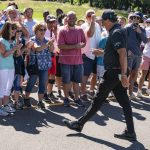 Phil Mickelson greets spectators as he walks to the 12th tee during the first round of the Travelers Championship golf tournament at TPC River Highlands, Thursday, June 24, 2021, in Cromwell, Conn. (AP Photo/John Minchillo)