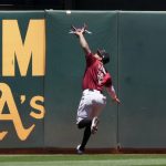 Arizona Diamondbacks center fielder Ketel Marte can't make the catch on a ball hit for a triple by Oakland Athletics' Mark Canha during the second inning of a baseball game Wednesday, June 9, 2021, in Oakland, Calif. (AP Photo/Tony Avelar)