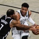 Brooklyn Nets' Kevin Durant (7) defends against Milwaukee Bucks' Giannis Antetokounmpo during the second half of Game 7 of a second-round NBA basketball playoff series Saturday, June 19, 2021, in New York. (AP Photo/Frank Franklin II)