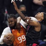 Phoenix Suns forward Jae Crowder, left, grabs a rebound away from Los Angeles Clippers guard Terance Mann during the second half in Game 6 of the NBA basketball Western Conference Finals Wednesday, June 30, 2021, in Los Angeles. (AP Photo/Mark J. Terrill)