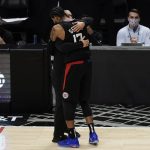 Los Angeles Clippers' Paul George and head coach Tyronn Lue hug in the final seconds of Game 6 of the NBA basketball Western Conference Finals Wednesday, June 30, 2021, in Los Angeles. The Suns won 130-103. (AP Photo/Jae C. Hong)
