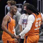 Phoenix Suns guard Chris Paul, left, and forward Jae Crowder celebrates as time runs out in Game 6 of the NBA basketball Western Conference Finals against the Los Angeles Clippers Wednesday, June 30, 2021, in Los Angeles. The Suns won the game 130-103 to take the series 4-2. (AP Photo/Mark J. Terrill)