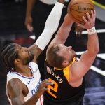 Los Angeles Clippers guard Paul George, left, guards Utah Jazz guard Joe Ingles (2) during the first half of Game 1 of a second-round NBA basketball playoff series Tuesday, June 8, 2021, in Salt Lake City. (AP Photo/Rick Bowmer)
