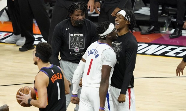 Los Angeles Clippers guard Reggie Jackson (1) celebrates a basket with teammates as Phoenix Suns gu...