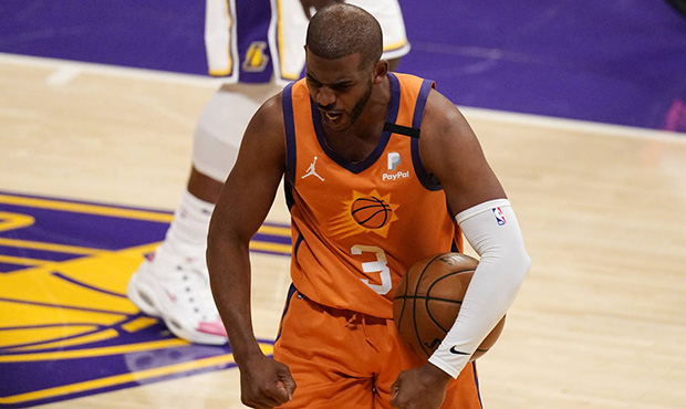 Phoenix Suns guard Chris Paul celebrates after forcing a turnover during the second half in Game 4 ...