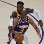 Los Angeles Lakers guard Dennis Schroder, back, defends against Phoenix Suns guard Chris Paul (3) during the third quarter of Game 6 of an NBA basketball first-round playoff series Thursday, June 3, 2021, in Los Angeles. (AP Photo/Ashley Landis)