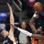 Phoenix Suns center Deandre Ayton, right, shoots as Los Angeles Clippers center Ivica Zubac defends during the first half in Game 3 of the NBA basketball Western Conference Finals Thursday, June 24, 2021, in Los Angeles. (AP Photo/Mark J. Terrill)