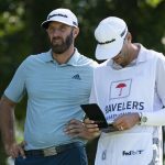 Dustin Johnson waits on the 11th tee with his caddie during the first round of the Travelers Championship golf tournament at TPC River Highlands, Thursday, June 24, 2021, in Cromwell, Conn. (AP Photo/John Minchillo)