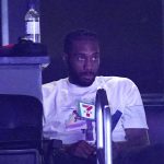 Los Angeles Clippers forward Kawhi Leonard sits in a suite during the first half in Game 4 of the NBA basketball Western Conference Finals against the Phoenix Suns Saturday, June 26, 2021, in Los Angeles. (AP Photo/Mark J. Terrill)
