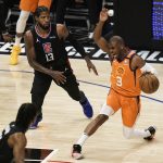 Phoenix Suns' Chris Paul, right, is pressured by Los Angeles Clippers' Paul George during the first half in Game 6 of the NBA basketball Western Conference Finals Saturday, June 26, 2021, in Los Angeles. (AP Photo/Jae C. Hong)