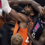 Phoenix Suns center Deandre Ayton, left, is fouled by Los Angeles Clippers guard Patrick Beverley during the first half in Game 6 of the NBA basketball Western Conference Finals Wednesday, June 30, 2021, in Los Angeles. (AP Photo/Mark J. Terrill)