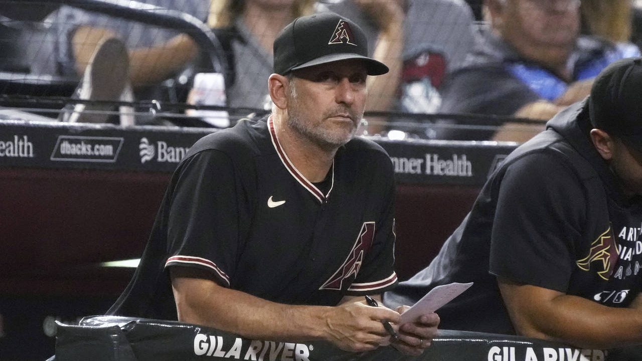 Arizona Diamondbacks manager Torey Lovullo watches from the dugout during the sixth inning of the t...