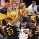 Utah Jazz's Rudy Gobert (27) and Royce O'Neale (23) defend against Los Angeles Clippers forward Kawhi Leonard, center, during the first half of Game 1 of a second-round NBA basketball playoff series Tuesday, June 8, 2021, in Salt Lake City. (AP Photo/Rick Bowmer)