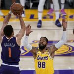 Phoenix Suns guard Devin Booker (1) shoots against Los Angeles Lakers forward Markieff Morris (88) during the third quarter of Game 6 of an NBA basketball first-round playoff series Thursday, June 3, 2021, in Los Angeles. (AP Photo/Ashley Landis)