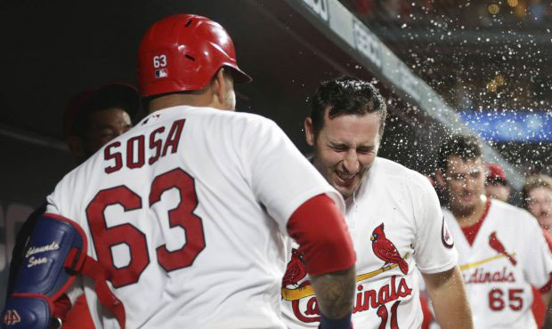 St. Louis Cardinals' Paul DeJong (11) is doused by teammate Edmundo Sosa after hitting a two-run ho...