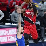Denver Nuggets guard Austin Rivers (25) fouls Portland Trail Blazers guard Damian Lillard (0) in the final seconds in the second half of Game 5 of a first-round NBA basketball playoff series Tuesday, June 1, 2021, in Denver. (AP Photo/Jack Dempsey)
