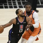 
              Los Angeles Clippers' Paul George, left, is defended by Phoenix Suns' Jae Crowder during the first half in Game 6 of the NBA basketball Western Conference Finals on Wednesday, June 30, 2021, in Los Angeles. (AP Photo/Jae C. Hong)
            