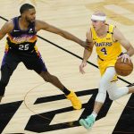 Los Angeles Lakers guard Alex Caruso (4) moves the ball upcourt as Phoenix Suns forward Mikal Bridges (25) defends during the first half of Game 5 of an NBA basketball first-round playoff series, Tuesday, June 1, 2021, in Phoenix. (AP Photo/Matt York)