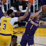 
              Los Angeles Lakers forward Anthony Davis (3) defends against Phoenix Suns guard Devin Booker (1) during the first quarter of Game 6 of an NBA basketball first-round playoff series Thursday, Jun 3, 2021, in Los Angeles. (AP Photo/Ashley Landis)
            
