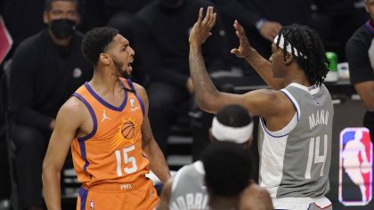 Phoenix Suns guard Cameron Payne, left, and Los Angeles Clippers guard Terance Mann scuffle during ...