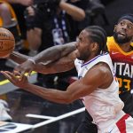 Utah Jazz forward Royce O'Neale, rear, fouls Los Angeles Clippers forward Kawhi Leonard during the first half of Game 1 of a second-round NBA basketball playoff series Tuesday, June 8, 2021, in Salt Lake City. (AP Photo/Rick Bowmer)