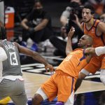 Los Angeles Clippers guard Paul George, left, fouls Phoenix Suns guard Chris Paul during the first half in Game 4 of the NBA basketball Western Conference Finals Saturday, June 26, 2021, in Los Angeles. (AP Photo/Mark J. Terrill)
